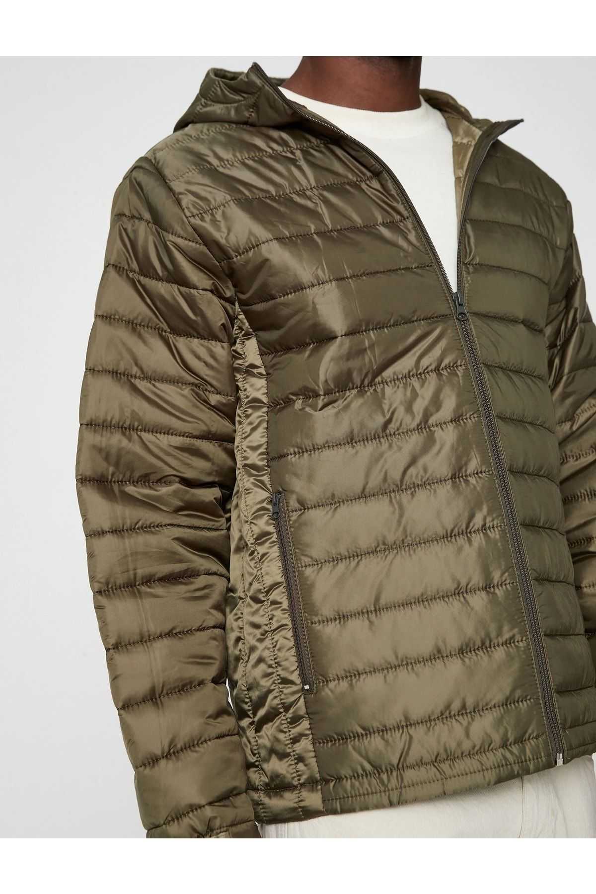 ژاکت پفی کلاهدار با جزئیات جیبی ضد آب