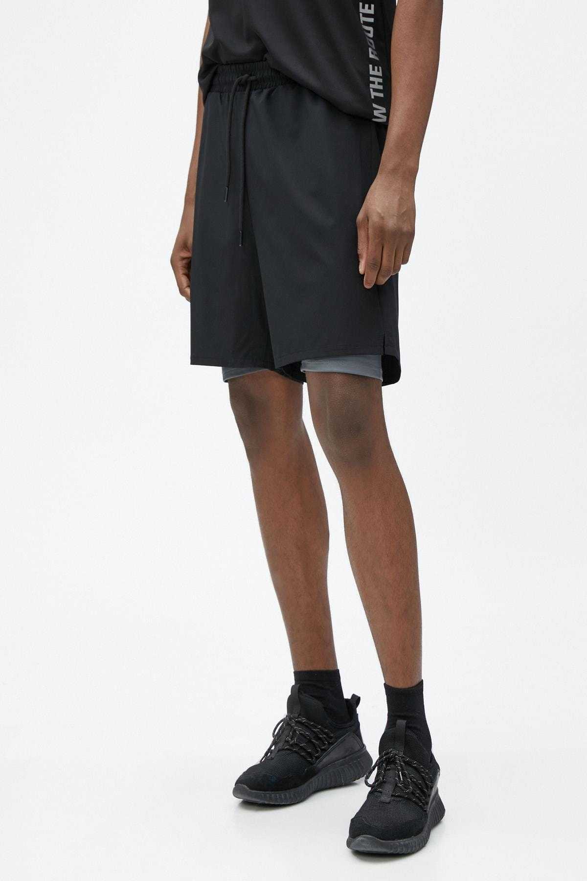 شلوارک اسپرت ساق دار دولایه با بند کمر