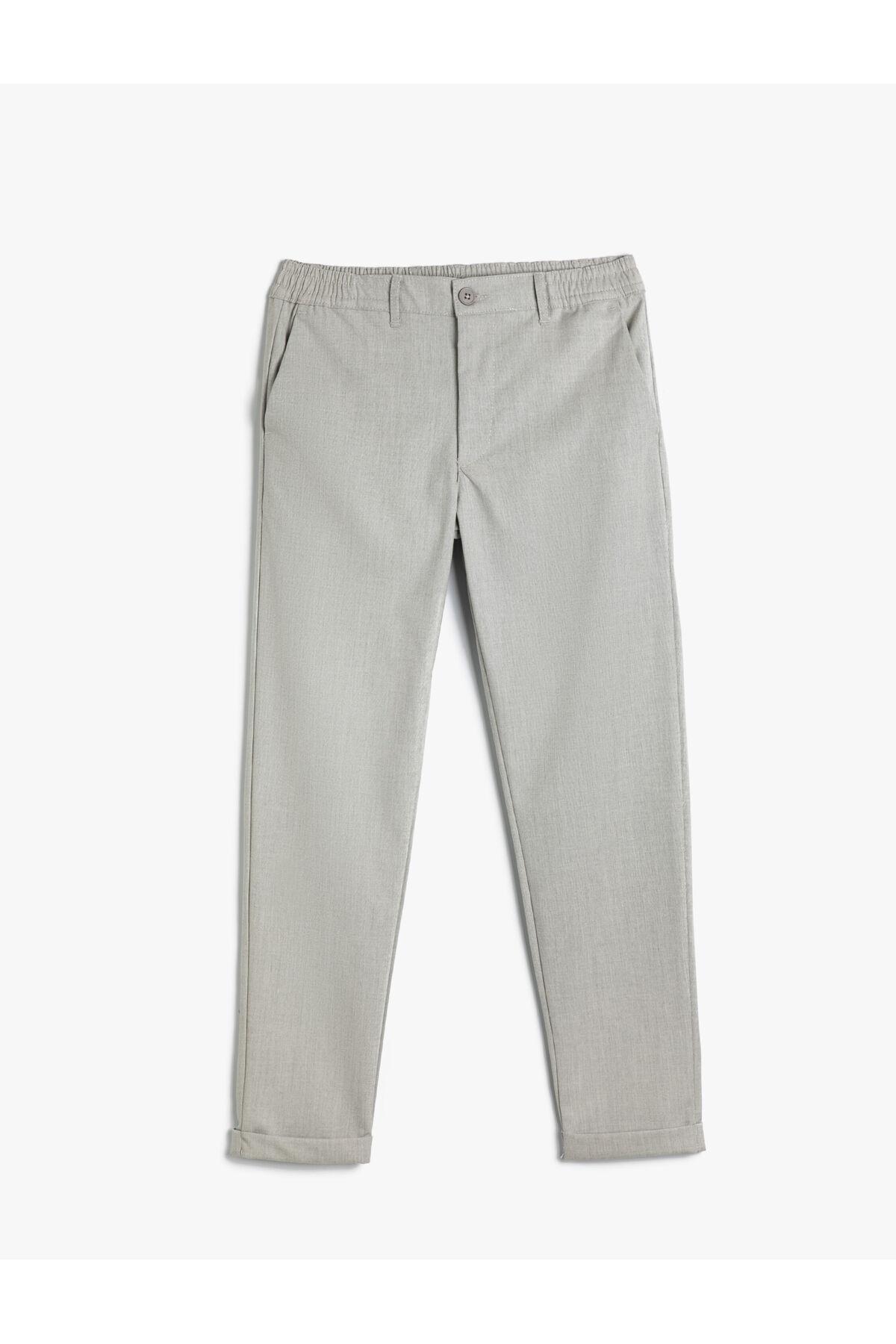 شلوار تناسب باریک با جیب الاستیک با دکمههای لایهای