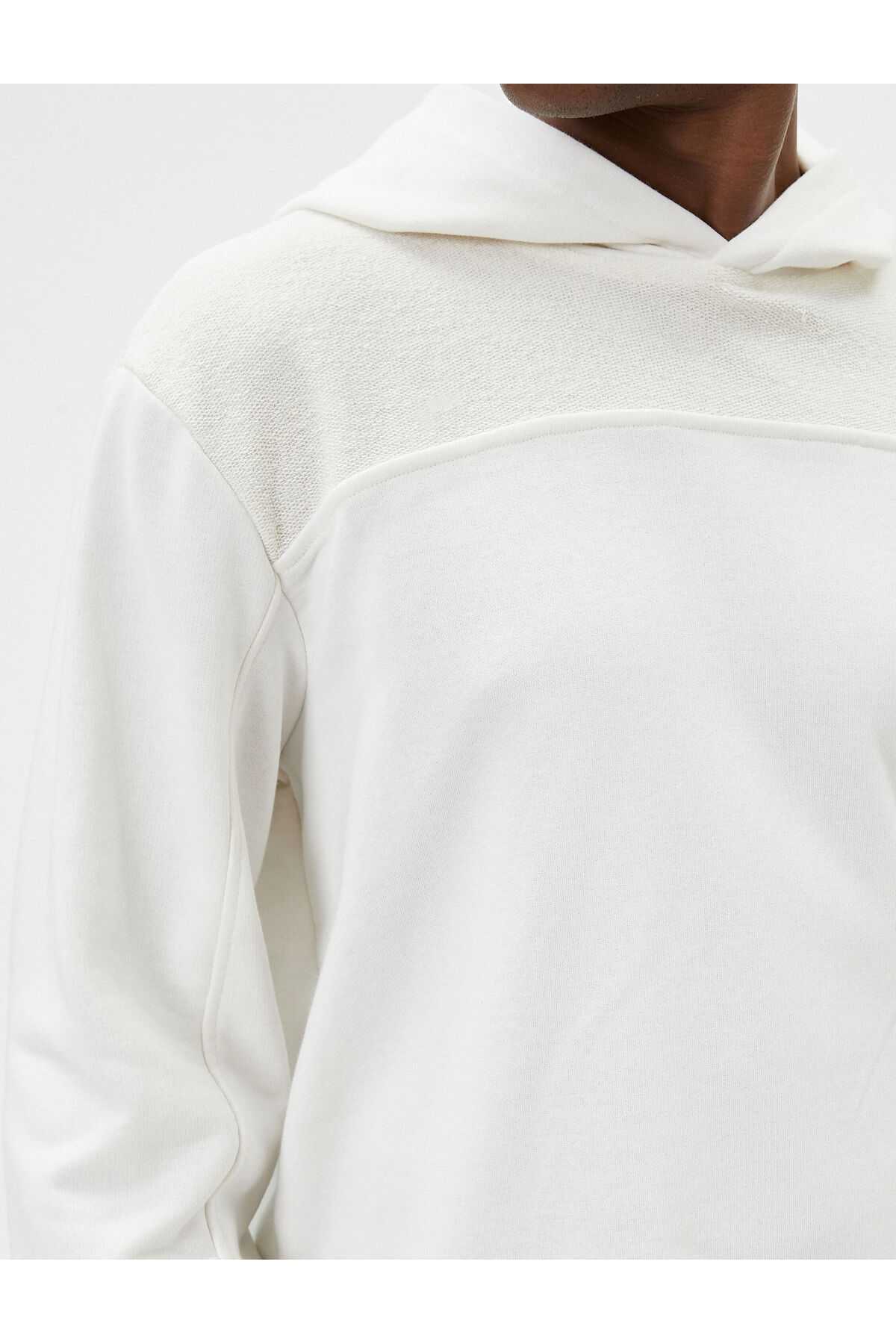 سویشرت کلاهدار با جزئیات دوخت بافتی آستین بلند