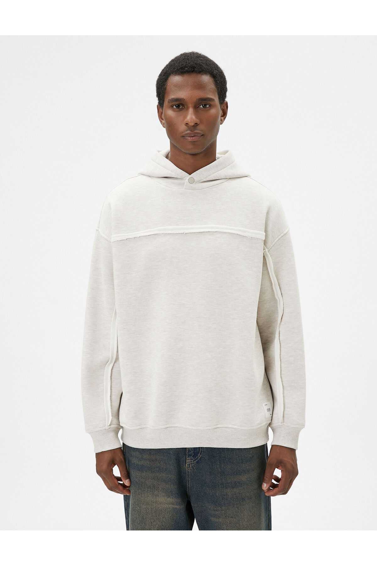 سویشرت کلاهدار بزرگ با جزئیات دوخت آستین بلند