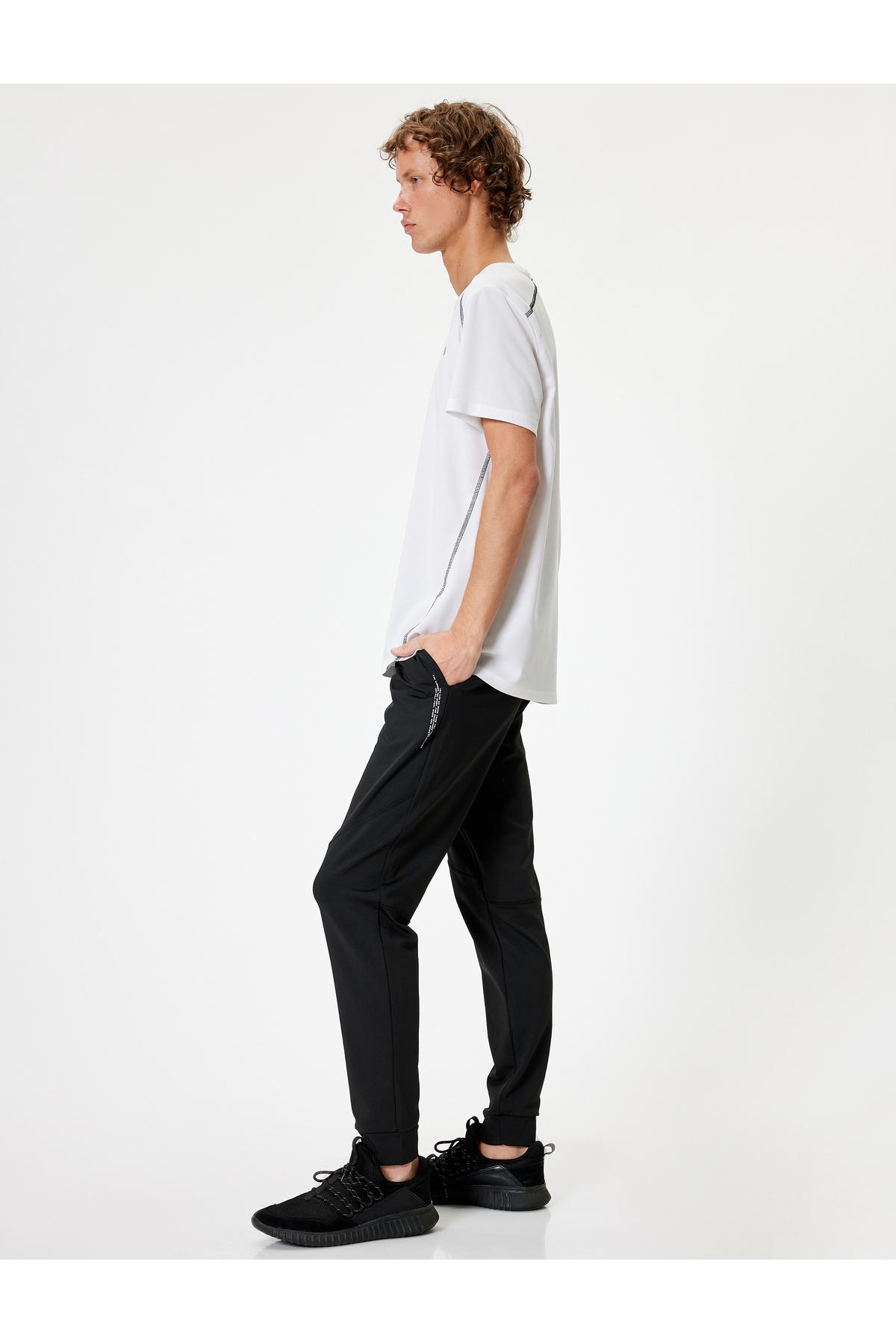 شلوار ورزشی ورزشی با جیب چاپ شده با شعار Jogger