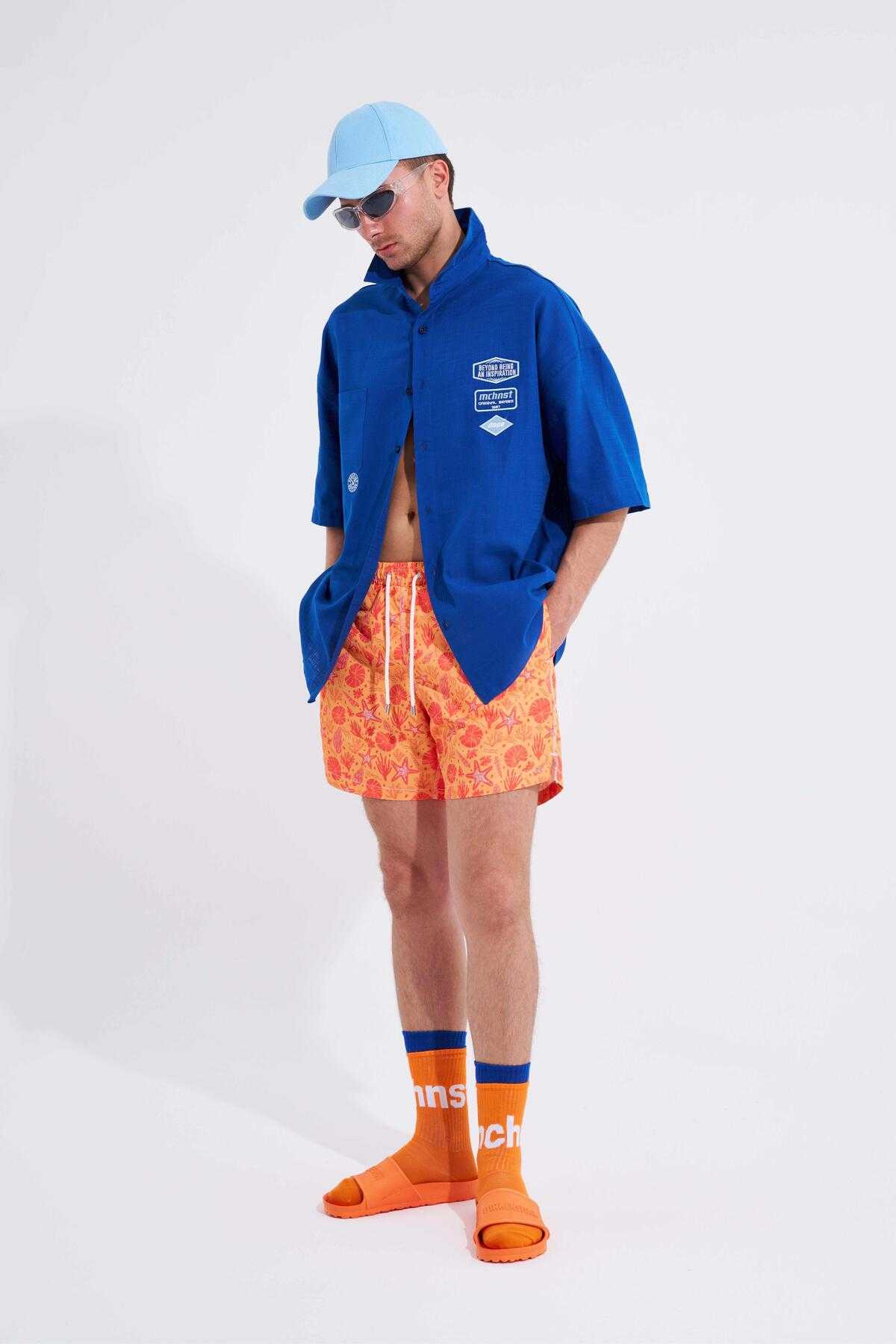 شلوار شنا مردانه با چاپ صدف زرد