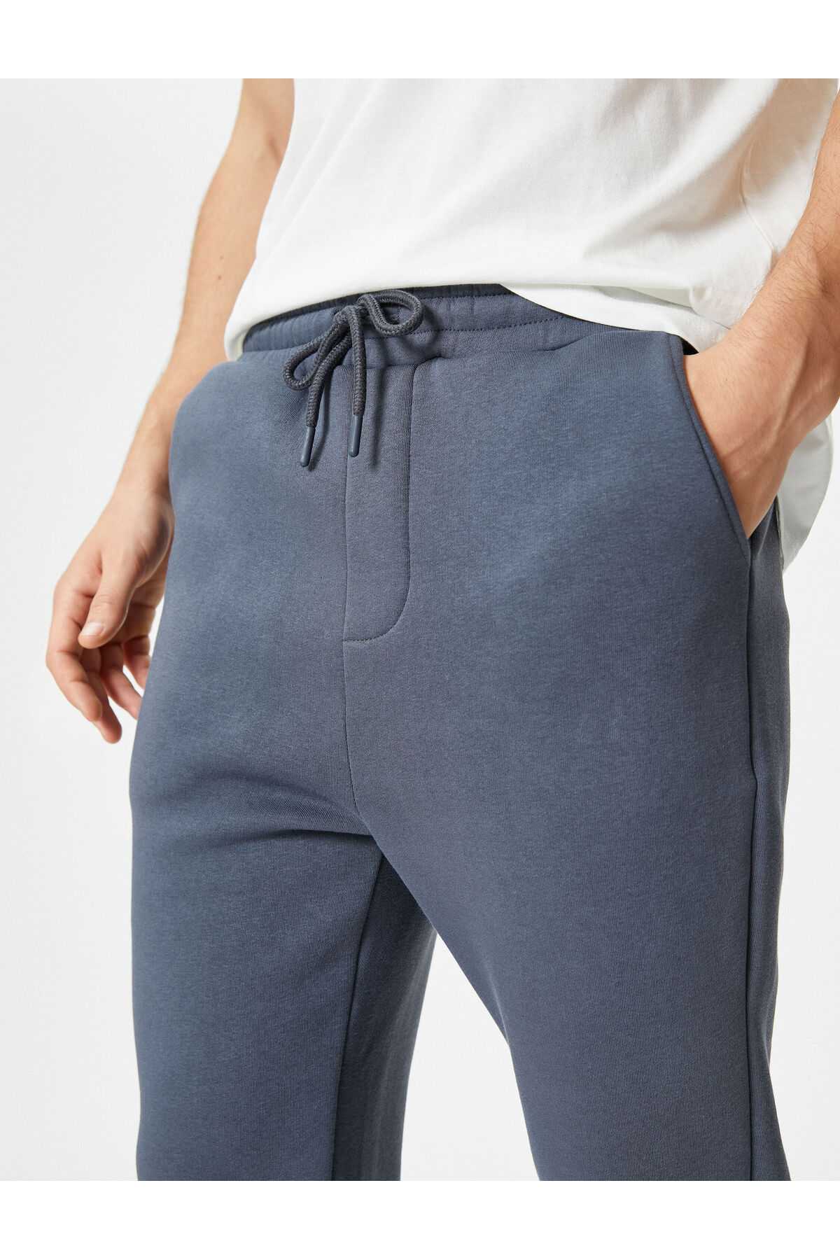 شلوار ورزشی پایه با جزئیات جیب و کمر بسته