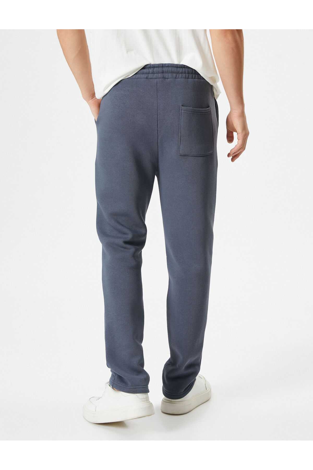 شلوار ورزشی پایه با جزئیات جیب و کمر بسته