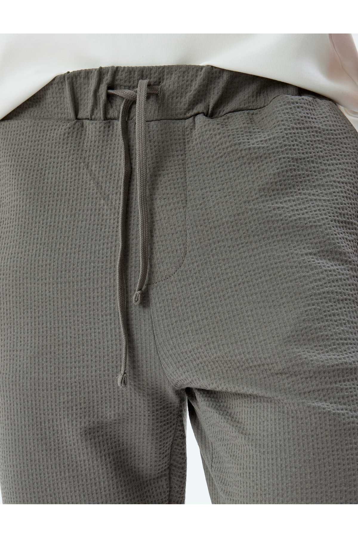 شلوار ورزشی نخی با جزئیات جیب دور کمر توری