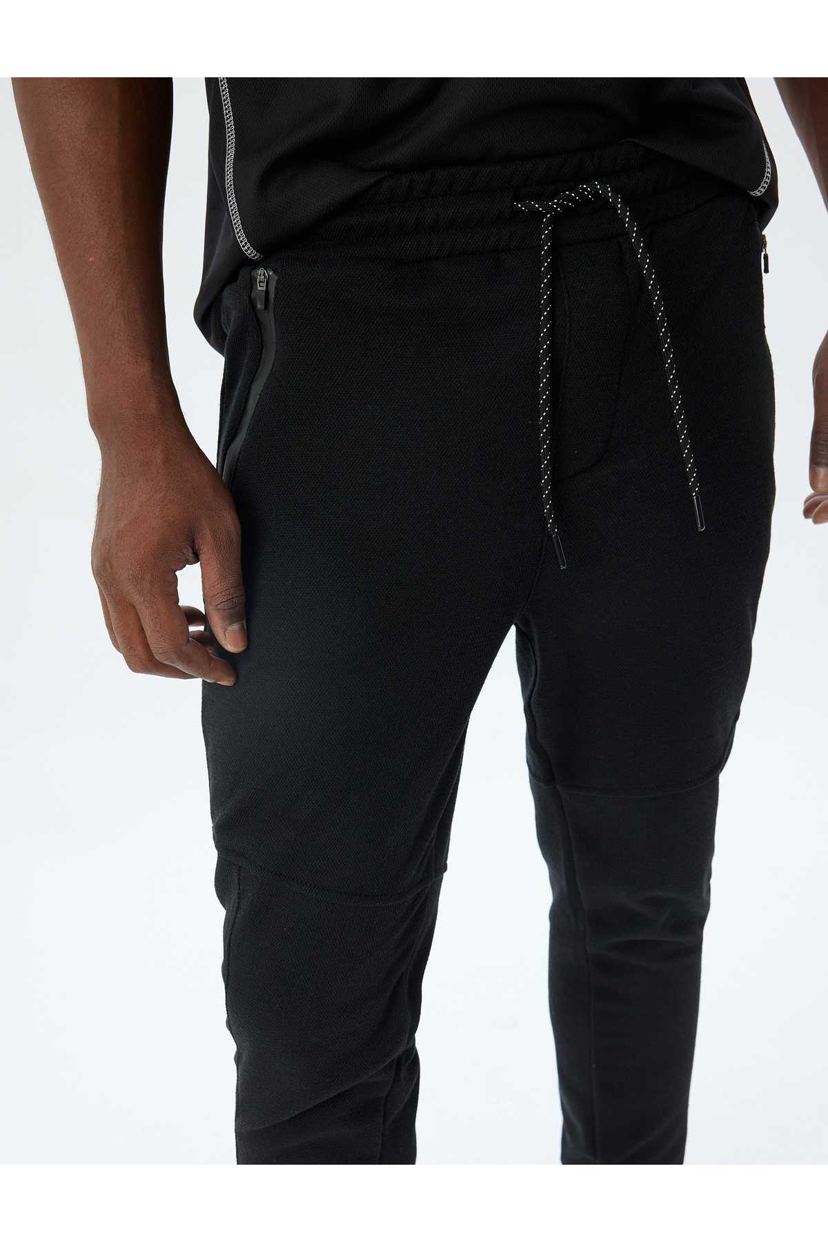 شلوار ورزشی اسپرت دوخت توری دور کمر ترکیبی پنبه ای با جزئیات