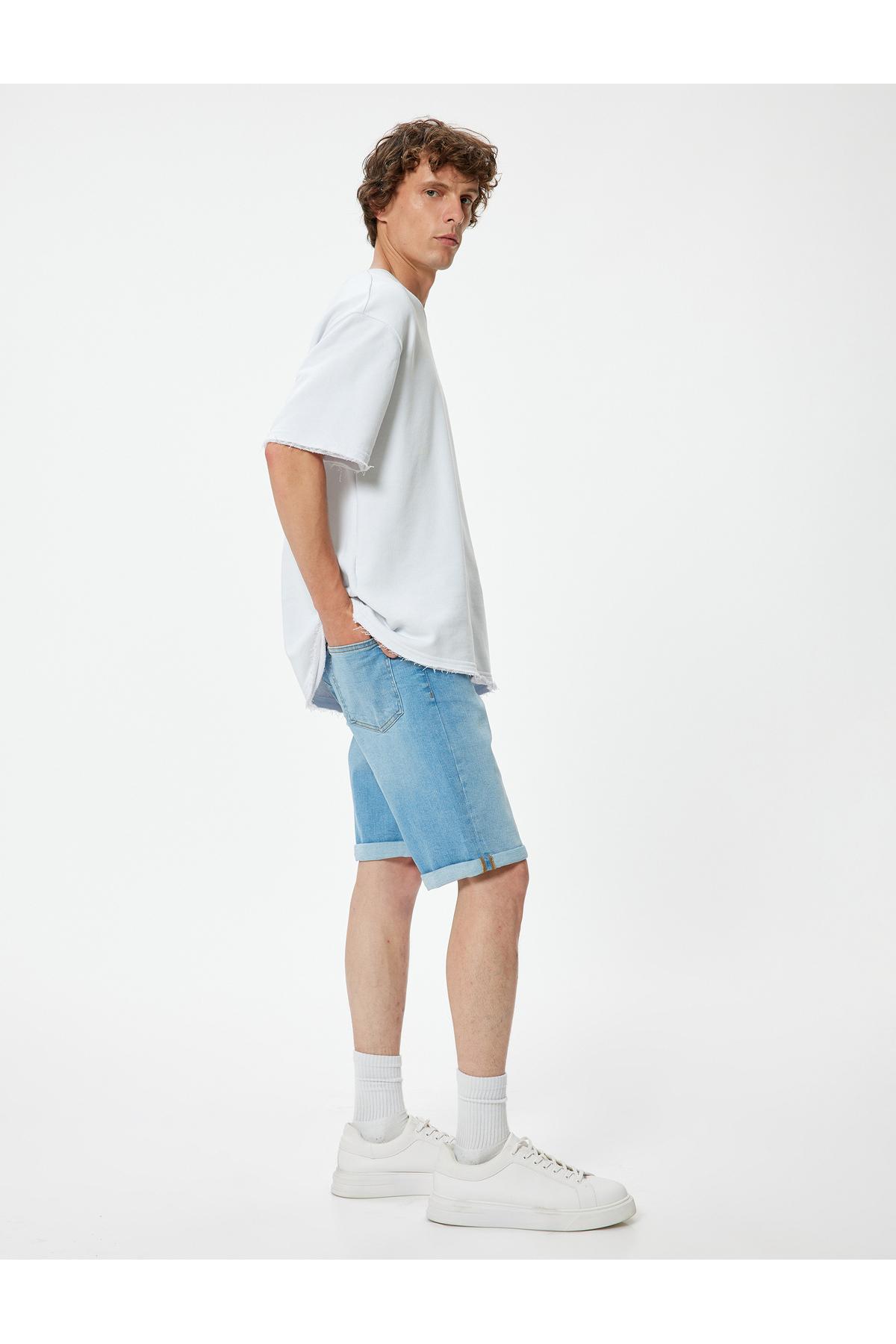 شلوارک جین باریک با دکمه کاف تاشو برمودا