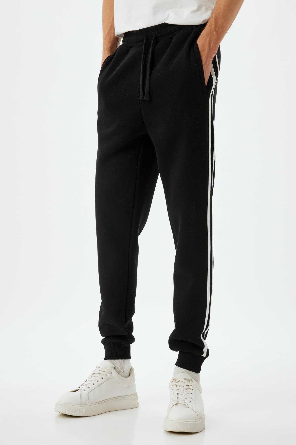 شلوار ورزشی با جیب توری بلند شده از جنس پنبه