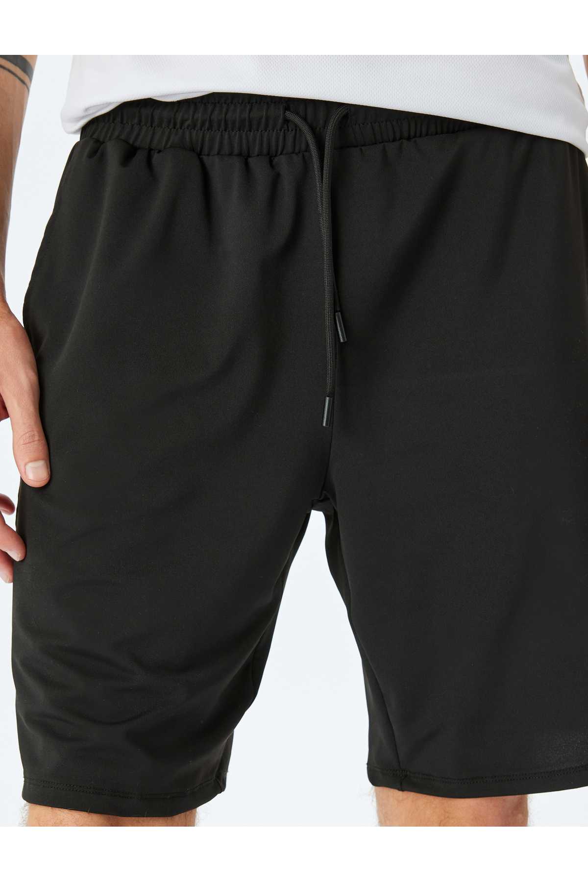 شلوارک اسپرت چاپ شده با جیب کمری توری